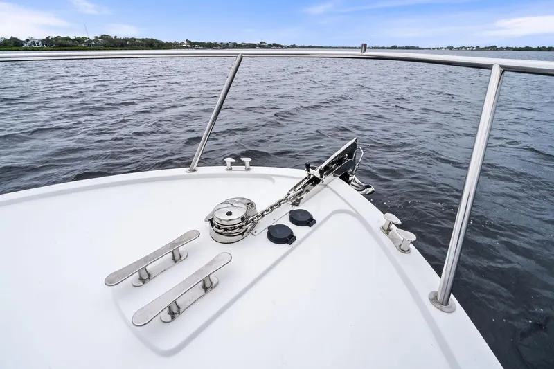 Tumalum Yacht Photos Pics Bow of 2023 MJM 35 boat with anchor and railing on calm water.