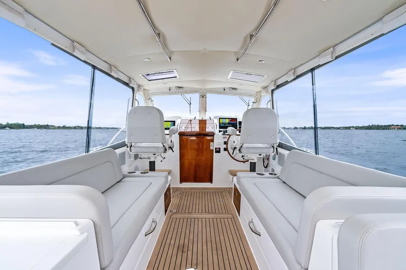 Tumalum Yacht Photos Pics Interior of 2023 MJM 35 boat with spacious seating and modern helm.