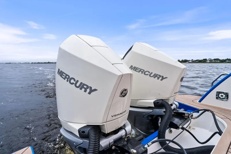 Tumalum Yacht Photos Pics Twin Mercury Verado outboard engines on a 2023 MJM 35 boat, cruising on open water.