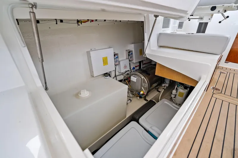 Tumalum Yacht Photos Pics 2023 MJM 35 boat storage compartment with equipment and storage bins.