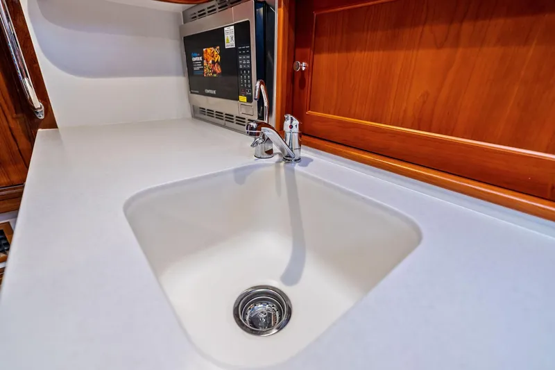 Tumalum Yacht Photos Pics Modern kitchen sink and microwave in 2023 MJM 35 yacht interior.