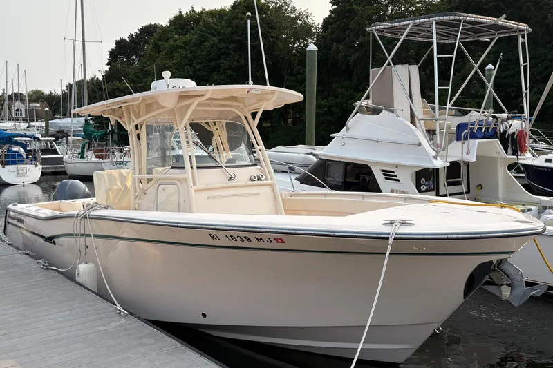  Yacht Photos Pics 2013 Grady-White Canyon 306 boat docked at marina with other vessels.