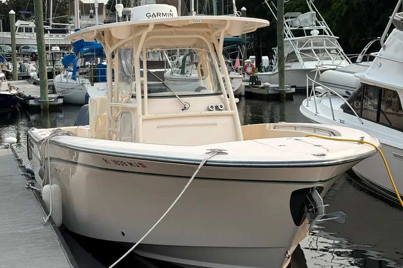  Yacht Photos Pics 2013 Grady-White Canyon 306 boat docked at marina with other vessels.