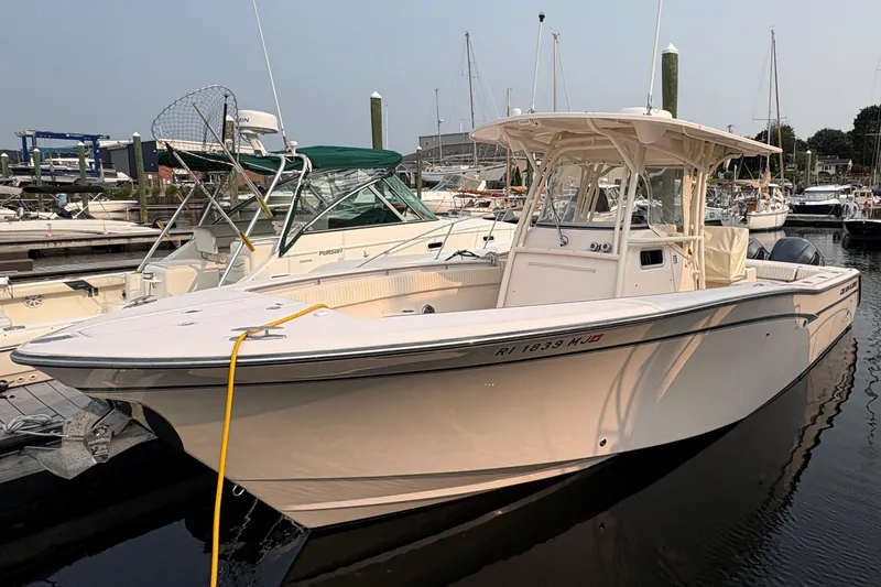  Yacht Photos Pics 2013 Grady-White Canyon 306 boat docked in a marina, side view.