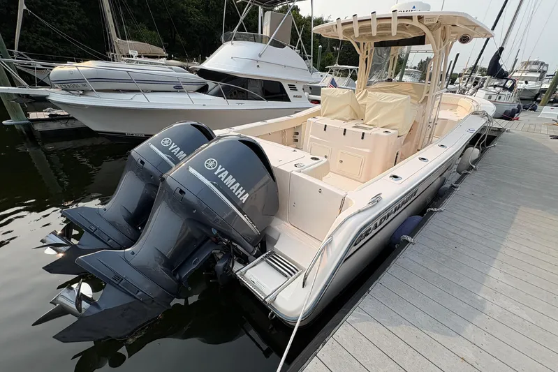  Yacht Photos Pics 2013 Grady-White Canyon 306 boat with twin Yamaha engines docked at marina.