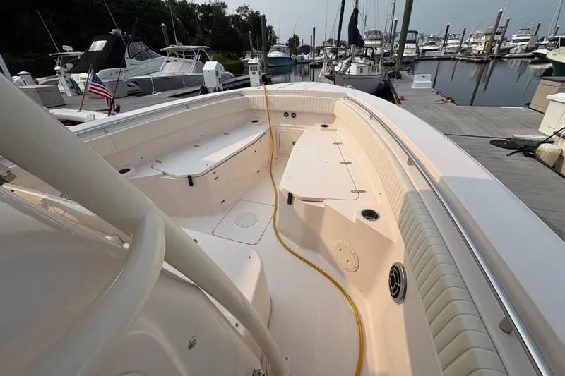  Yacht Photos Pics 2013 Grady-White Canyon 306 boat docked at marina, showcasing spacious deck layout.