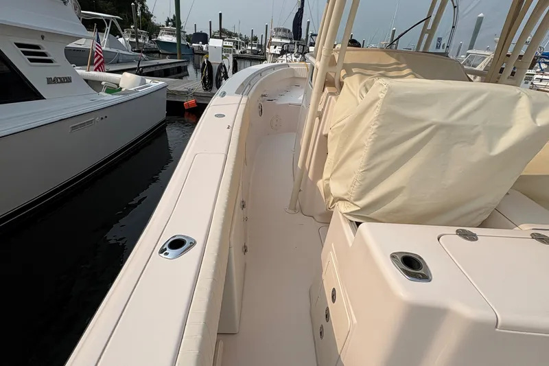  Yacht Photos Pics 2013 Grady-White Canyon 306 boat docked at marina, side view.