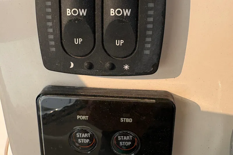  Yacht Photos Pics Control panel of a 2013 Grady-White Canyon 306 boat with bow and engine switches.