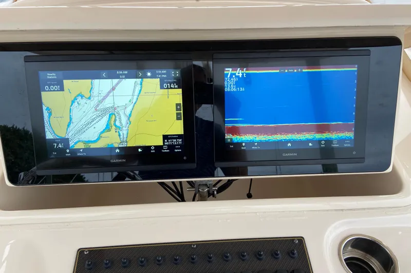  Yacht Photos Pics Garmin navigation screens on a 2013 Grady-White Canyon 306 boat dashboard.