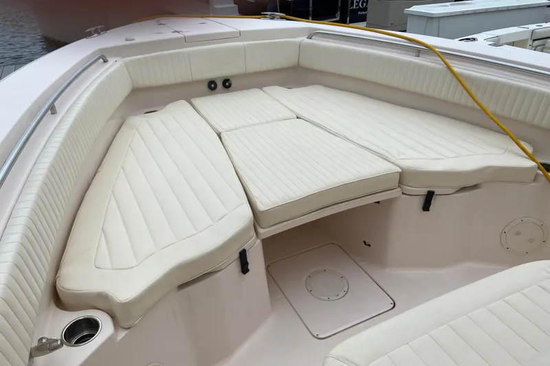  Yacht Photos Pics 2013 Grady-White Canyon 306 boat interior with cushioned seating and cup holders.