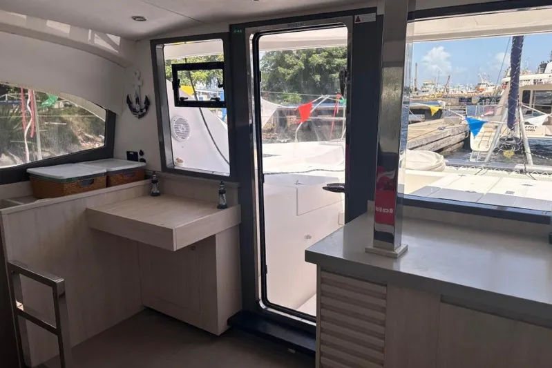 Sweet 2 Bad Yacht Photos Pics Interior of a 2016 Leopard 404 yacht with modern kitchen and marina view.