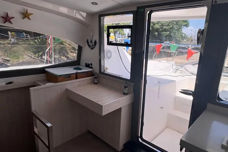 Sweet 2 Bad Yacht Photos Pics Interior of a 2016 Leopard 404 catamaran with a view of the deck.