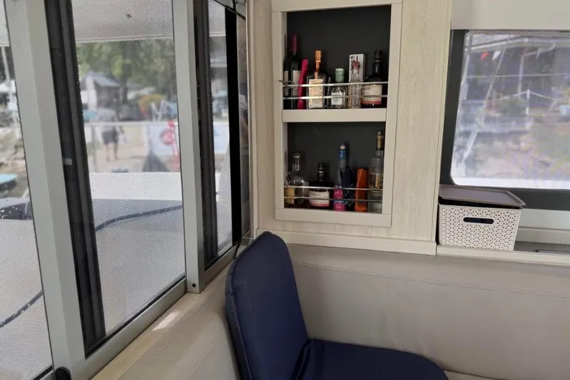 Sweet 2 Bad Yacht Photos Pics Interior of a 2016 Leopard 404 yacht with a stocked liquor cabinet.