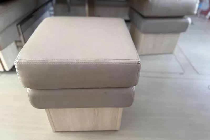 Sweet 2 Bad Yacht Photos Pics Beige cushioned seating on Leopard 404, 2016 model, with wooden base.