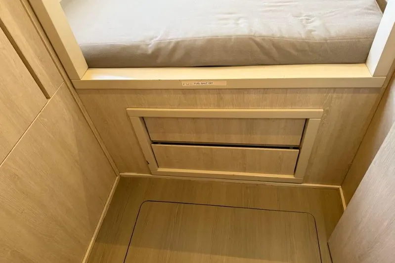 Sweet 2 Bad Yacht Photos Pics Compact cabin interior with wooden finish and cushioned seating, Leopard 404, 2016 model.