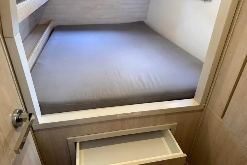 Sweet 2 Bad Yacht Photos Pics Compact sleeping area with storage drawer in a 2016 Leopard 404 model.