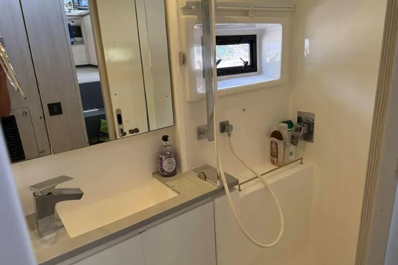 Sweet 2 Bad Yacht Photos Pics Modern bathroom in 2016 Leopard 404 yacht with sink, mirror, and shower.