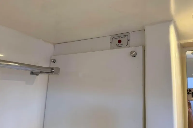 Sweet 2 Bad Yacht Photos Pics Tank level monitor in a 2016 Leopard 404 interior, with towel rack and mirror.