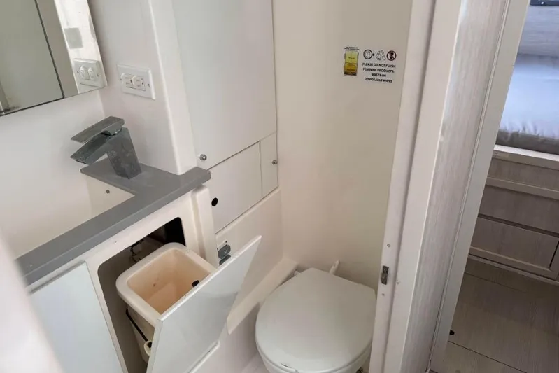 Sweet 2 Bad Yacht Photos Pics Compact bathroom in 2016 Leopard 404 with modern fixtures and storage.