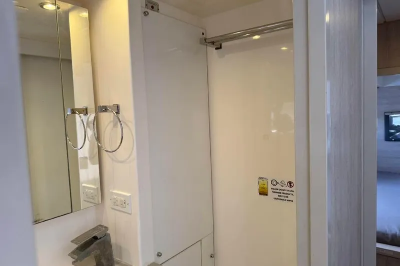 Sweet 2 Bad Yacht Photos Pics Modern bathroom interior in 2016 Leopard 404 yacht, featuring sleek fixtures and mirrored cabinets.