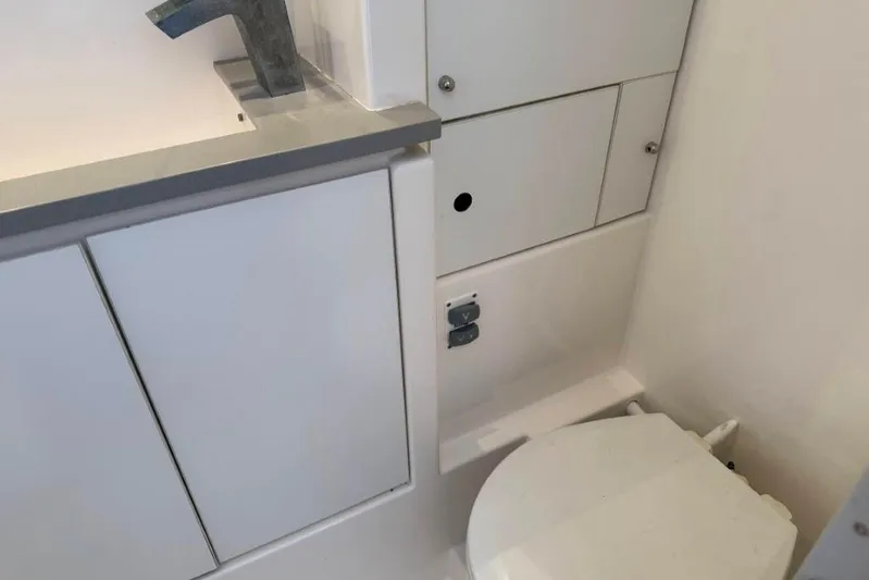 Sweet 2 Bad Yacht Photos Pics Compact bathroom in 2016 Leopard 404 yacht with sink and toilet.