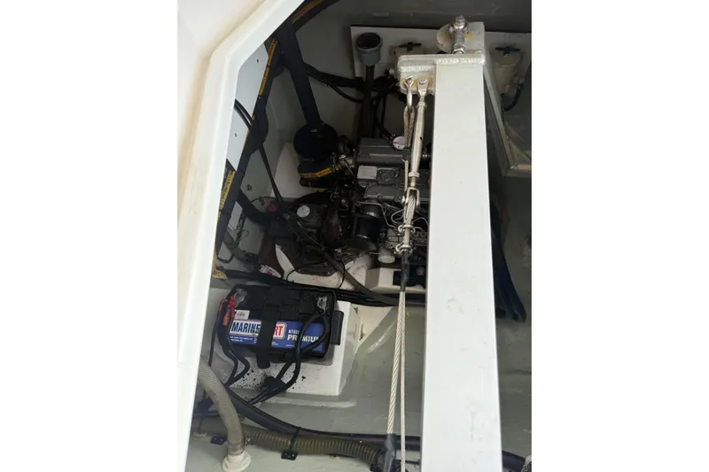 Sweet 2 Bad Yacht Photos Pics Engine compartment of a 2016 Leopard 404 boat, featuring marine battery and components.