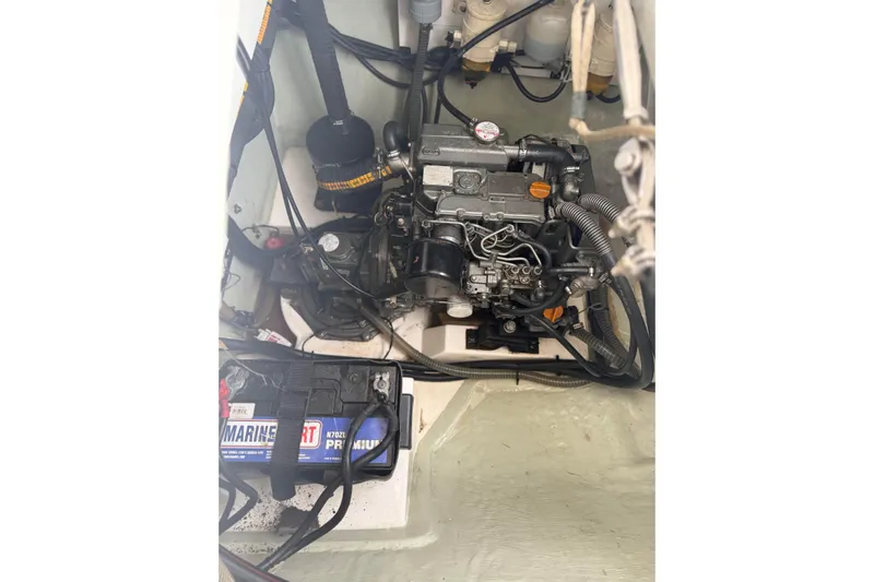 Sweet 2 Bad Yacht Photos Pics Engine compartment of a 2016 Leopard 404 with visible marine battery and components.