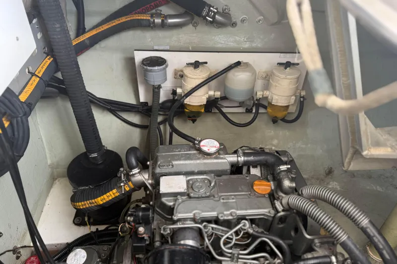 Sweet 2 Bad Yacht Photos Pics Engine compartment of a 2016 Leopard 404, showcasing hoses and fuel filters.