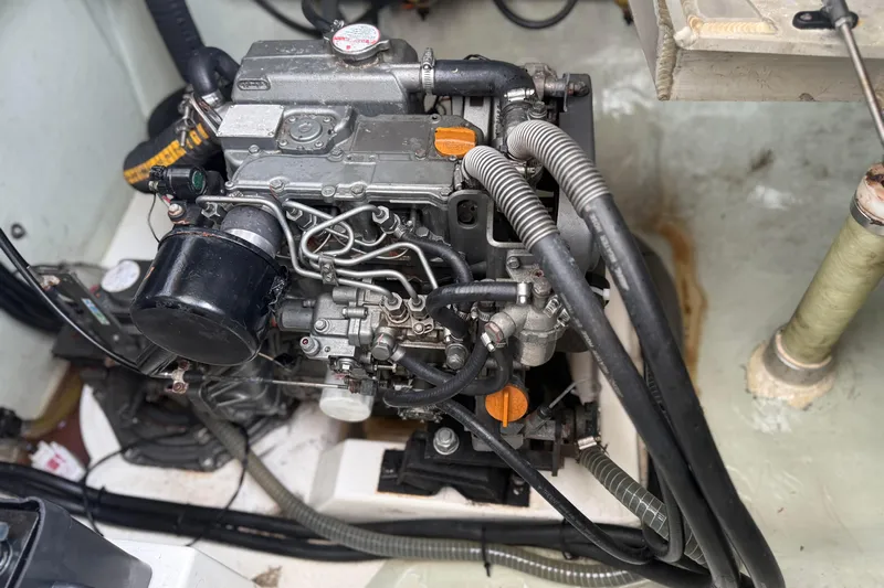 Sweet 2 Bad Yacht Photos Pics Engine compartment of a 2016 Leopard 404, showcasing intricate mechanical components and hoses.