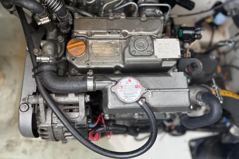 Sweet 2 Bad Yacht Photos Pics Engine of a 2016 Leopard 404, showcasing intricate mechanical components and hoses.