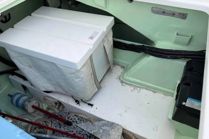 Sweet 2 Bad Yacht Photos Pics Storage compartment of a 2016 Leopard 404 boat with battery box and ropes.