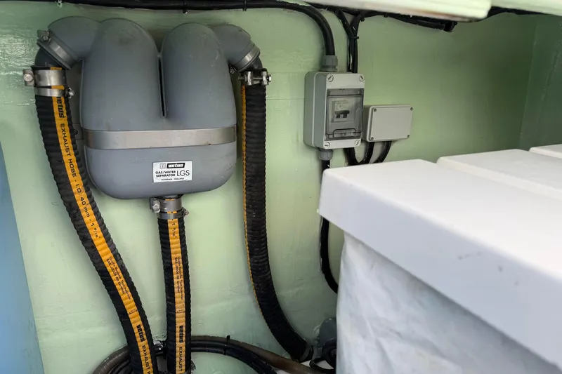 Sweet 2 Bad Yacht Photos Pics Gas-water separator system in a 2016 Leopard 404 boat engine compartment.