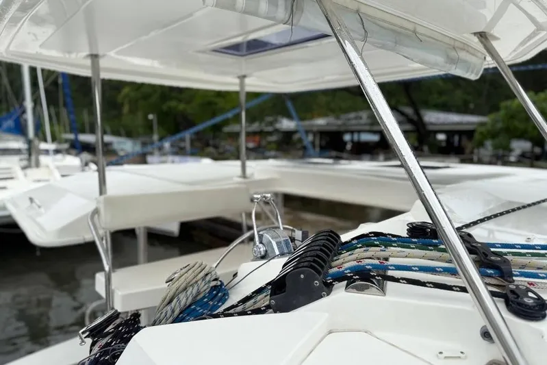 Sweet 2 Bad Yacht Photos Pics 2016 Leopard 404 catamaran deck with ropes and winches in a marina setting.