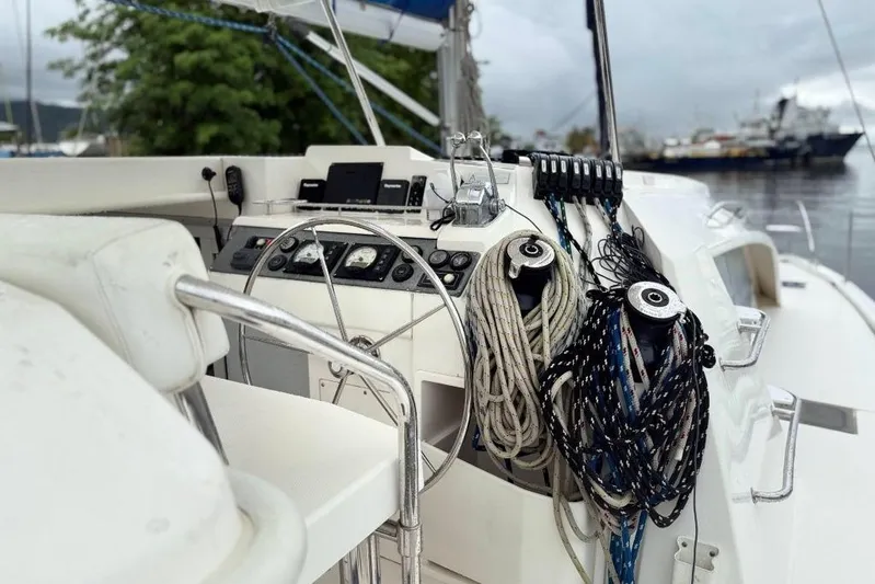 Sweet 2 Bad Yacht Photos Pics Steering area of a 2016 Leopard 404 yacht with ropes and controls.