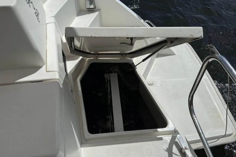Sweet 2 Bad Yacht Photos Pics Open hatch on 2016 Leopard 404 boat, revealing interior compartment by the water.