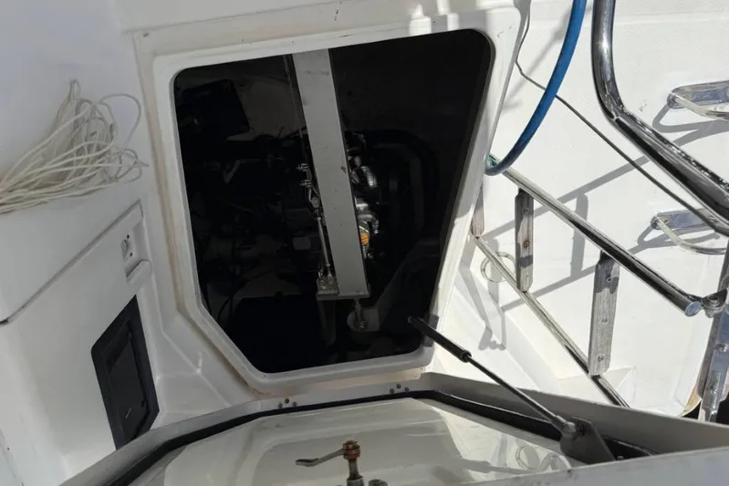 Sweet 2 Bad Yacht Photos Pics Engine compartment of a 2016 Leopard 404 catamaran, showing interior mechanical components.
