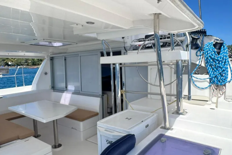 Sweet 2 Bad Yacht Photos Pics 2017 Leopard 40 catamaran interior with seating, table, and nautical equipment.