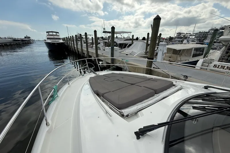 Top Nach Yacht Photos Pics Prestige 500S 2017 yacht docked at marina with sun pad and clear sky.