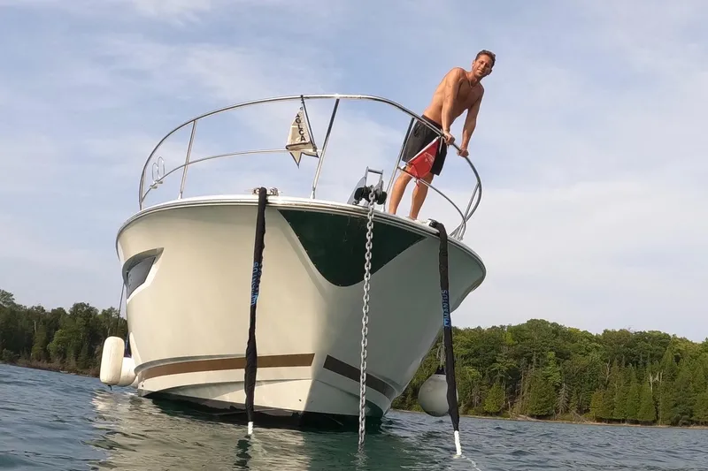 Top Nach Yacht Photos Pics Man on 2017 Prestige 500S yacht, enjoying a sunny day on the water.