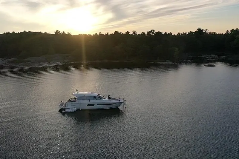 Top Nach Yacht Photos Pics Prestige 500S yacht on serene lake at sunset, 2017 model.