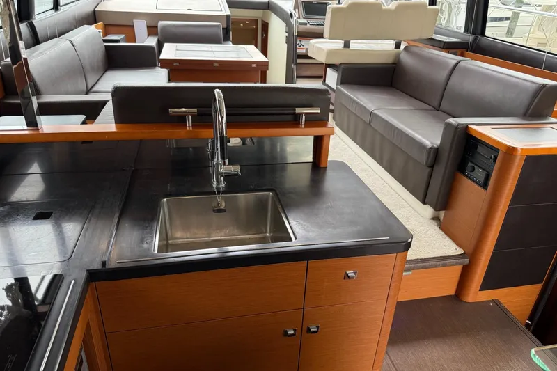 Top Nach Yacht Photos Pics Luxurious interior of 2017 Prestige 500S yacht with modern kitchen and seating area.