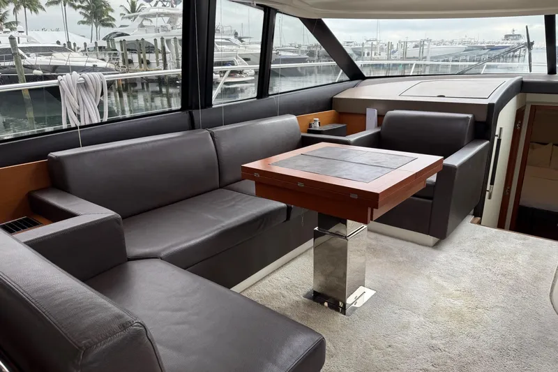 Top Nach Yacht Photos Pics Luxurious interior of 2017 Prestige 500S yacht with leather seating and elegant table.