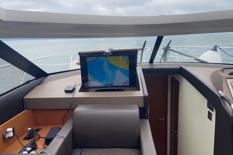 Top Nach Yacht Photos Pics Interior view of 2017 Prestige 500S yacht with navigation screen and sea view.