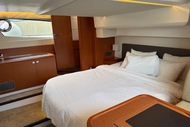 Top Nach Yacht Photos Pics Luxurious bedroom interior of 2017 Prestige 500S yacht with elegant wood finishes.