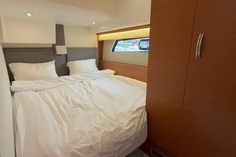 Top Nach Yacht Photos Pics Cozy bedroom in 2017 Prestige 500S yacht with modern design and window view.