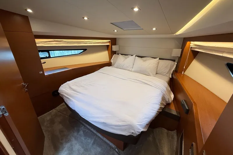Top Nach Yacht Photos Pics Luxurious bedroom interior of 2017 Prestige 500S yacht with cozy bedding and modern lighting.