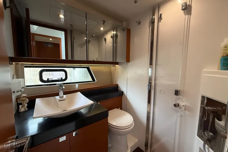 Top Nach Yacht Photos Pics Luxurious bathroom in 2017 Prestige 500S yacht with modern fixtures and elegant design.