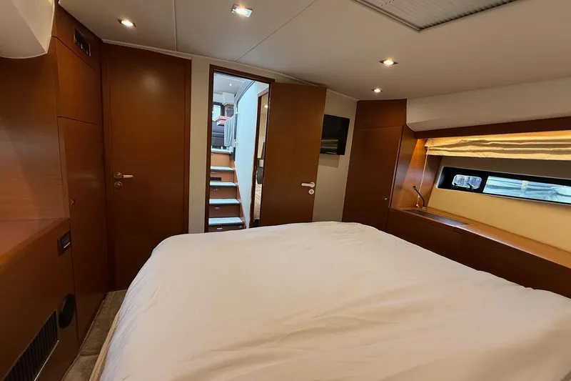 Top Nach Yacht Photos Pics Luxurious bedroom interior of 2017 Prestige 500S yacht with modern wood finishes.