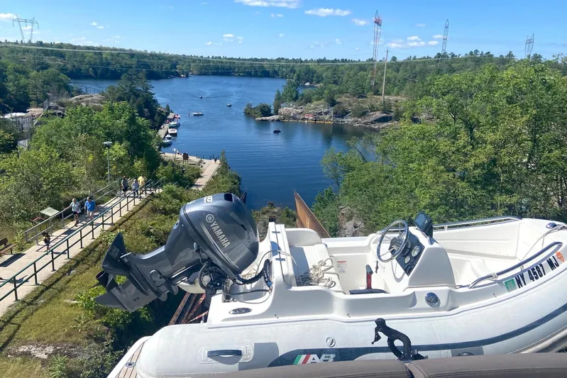 Top Nach Yacht Photos Pics 2017 Prestige 500S boat with Yamaha engine overlooking scenic river and lush greenery.
