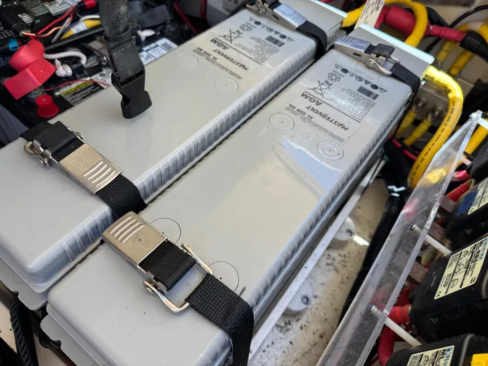 Sea Dragon Yacht Photos Pics Battery compartment of 2023 Chris-Craft Calypso 35 with secured power units and wiring.